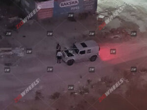 The spy shots of the 5-door Mahindra Thar suggest several new features and updates compared to the 3-door version. Here's a summary. Features Sunroof: The 5-door Thar will come equipped with a single-pane sunroof. It is positioned between the front and second rows, indicating that the vehicle may have a full metal hard top to accommodate this feature. LED Lighting: The presence of LED fog lamps on the test mule suggests that the production version of the 5-door Thar will have a complete LED lighting setup. Cabin and Features: Mahindra might offer an all-black cabin for the 5-door Thar, as seen in one of the test mules. The SUV will feature an 8-inch touchscreen infotainment system with connected car technology, auto climate control, and cruise control. Safety features may include up to six airbags, electronic stability control (ESC), and a rear parking camera. Engine Engine Options: The 5-door Thar will likely have the same petrol and diesel engine options as the 3-door version. These engines are expected to be in higher states of tune. The 3-door Thar currently offers a 2.0-litre turbo-petrol engine with 150PS and a 2.2-litre diesel engine with 130PS. The 5-door Thar may also come with 2WD variants and will be available with both manual and automatic gearbox options. Launch and Price: Mahindra has confirmed that the 5-door Thar will be launched in 2024. The expected starting price for the SUV is around Rs 15 lakh (ex-showroom). Here are some additional details about each of the pros and cons of the current Mahindra Thar Pros: Rugged and capable off-roader: The Mahindra Thar is one of the most capable off-roaders in its class. It has a 4x4 drivetrain with high and low-range gears and a locking differential. It also has a ground clearance of 226 mm and approach and departure angles of 41 and 37 degrees, respectively. This makes it perfect for tackling any terrain, from the roughest trails to the most challenging off-road courses. Powerful engines: The Mahindra Thar has two powerful engines: a 2.0-litre turbo-petrol engine and a 2.2-litre diesel engine. The petrol engine produces 150 PS and 320 Nm of torque, while the diesel engine produces 130 PS and 320 Nm of torque. Both engines are mated to a 6-speed manual transmission, with an automatic transmission available. Spacious and comfortable interior: The Mahindra Thar has a spacious and comfortable interior. The front seats are supportive and comfortable, even on long journeys. The rear seats are also spacious and can comfortably accommodate two adults. The cabin is also well-appointed, with features such as a touchscreen infotainment system, automatic climate control, and cruise control. Good value for money: The Mahindra Thar is a good value for money. It offers a lot of features and capabilities for its price. It is also backed by a strong warranty. Wide range of variants to choose from: The Mahindra Thar is available in a wide range of variants. This includes both 2-door and 4-door variants and a soft-top and hard-top. There are also a variety of engine and transmission options to choose from. This makes it easy to find the perfect Thar for your needs. Cons: Poor fuel economy: The Mahindra Thar has poor fuel economy. The petrol engine returns an average of 10-12 km in the city and 14-16 km on the highway. The diesel engine is slightly more fuel-efficient, producing an average of 12-14 km in the city and 16-18 km on the highway. NVH levels can be high on the highway: The Mahindra Thar can be noisy. The engine and road noise can be intrusive, making talking or listening to music difficult. Some safety features need to be added on lower variants: Some safety features, such as airbags and ABS, are missing on lower variants of the Mahindra Thar. This is a concern, as these features can be critical in an accident. Not as refined as some of its rivals: The Mahindra Thar is less advanced than some competitors. The ride can be bumpy, and the handling can be agricultural. This is not a significant concern for off-road enthusiasts, but it may be a turn-off for those looking for a more comfortable and refined SUV. Overall, the Mahindra Thar is an excellent choice for buyers looking for a capable and stylish off-roader. However, it is essential to consider its fuel economy, NVH levels, and lack of some safety features before making a decision. Conclusion The 5-door Thar will offer a more extensive alternative to the Maruti Jimny and will likely compete with the upcoming 5-door Force Gurkha. Source: Zigwheels