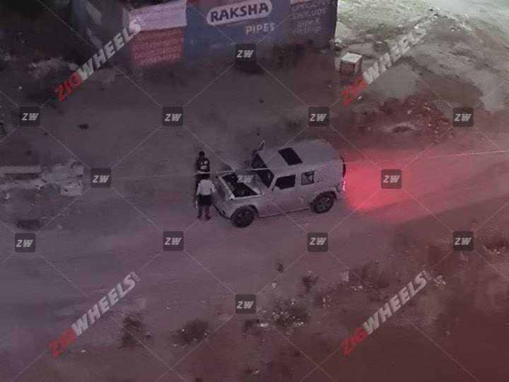 The spy shots of the 5-door Mahindra Thar suggest several new features and updates compared to the 3-door version. Here's a summary. Features Sunroof: The 5-door Thar will come equipped with a single-pane sunroof. It is positioned between the front and second rows, indicating that the vehicle may have a full metal hard top to accommodate this feature. LED Lighting: The presence of LED fog lamps on the test mule suggests that the production version of the 5-door Thar will have a complete LED lighting setup. Cabin and Features: Mahindra might offer an all-black cabin for the 5-door Thar, as seen in one of the test mules. The SUV will feature an 8-inch touchscreen infotainment system with connected car technology, auto climate control, and cruise control. Safety features may include up to six airbags, electronic stability control (ESC), and a rear parking camera. Engine Engine Options: The 5-door Thar will likely have the same petrol and diesel engine options as the 3-door version. These engines are expected to be in higher states of tune. The 3-door Thar currently offers a 2.0-litre turbo-petrol engine with 150PS and a 2.2-litre diesel engine with 130PS. The 5-door Thar may also come with 2WD variants and will be available with both manual and automatic gearbox options. Launch and Price: Mahindra has confirmed that the 5-door Thar will be launched in 2024. The expected starting price for the SUV is around Rs 15 lakh (ex-showroom). Here are some additional details about each of the pros and cons of the current Mahindra Thar Pros: Rugged and capable off-roader: The Mahindra Thar is one of the most capable off-roaders in its class. It has a 4x4 drivetrain with high and low-range gears and a locking differential. It also has a ground clearance of 226 mm and approach and departure angles of 41 and 37 degrees, respectively. This makes it perfect for tackling any terrain, from the roughest trails to the most challenging off-road courses. Powerful engines: The Mahindra Thar has two powerful engines: a 2.0-litre turbo-petrol engine and a 2.2-litre diesel engine. The petrol engine produces 150 PS and 320 Nm of torque, while the diesel engine produces 130 PS and 320 Nm of torque. Both engines are mated to a 6-speed manual transmission, with an automatic transmission available. Spacious and comfortable interior: The Mahindra Thar has a spacious and comfortable interior. The front seats are supportive and comfortable, even on long journeys. The rear seats are also spacious and can comfortably accommodate two adults. The cabin is also well-appointed, with features such as a touchscreen infotainment system, automatic climate control, and cruise control. Good value for money: The Mahindra Thar is a good value for money. It offers a lot of features and capabilities for its price. It is also backed by a strong warranty. Wide range of variants to choose from: The Mahindra Thar is available in a wide range of variants. This includes both 2-door and 4-door variants and a soft-top and hard-top. There are also a variety of engine and transmission options to choose from. This makes it easy to find the perfect Thar for your needs. Cons: Poor fuel economy: The Mahindra Thar has poor fuel economy. The petrol engine returns an average of 10-12 km in the city and 14-16 km on the highway. The diesel engine is slightly more fuel-efficient, producing an average of 12-14 km in the city and 16-18 km on the highway. NVH levels can be high on the highway: The Mahindra Thar can be noisy. The engine and road noise can be intrusive, making talking or listening to music difficult. Some safety features need to be added on lower variants: Some safety features, such as airbags and ABS, are missing on lower variants of the Mahindra Thar. This is a concern, as these features can be critical in an accident. Not as refined as some of its rivals: The Mahindra Thar is less advanced than some competitors. The ride can be bumpy, and the handling can be agricultural. This is not a significant concern for off-road enthusiasts, but it may be a turn-off for those looking for a more comfortable and refined SUV. Overall, the Mahindra Thar is an excellent choice for buyers looking for a capable and stylish off-roader. However, it is essential to consider its fuel economy, NVH levels, and lack of some safety features before making a decision. Conclusion The 5-door Thar will offer a more extensive alternative to the Maruti Jimny and will likely compete with the upcoming 5-door Force Gurkha. Source: Zigwheels